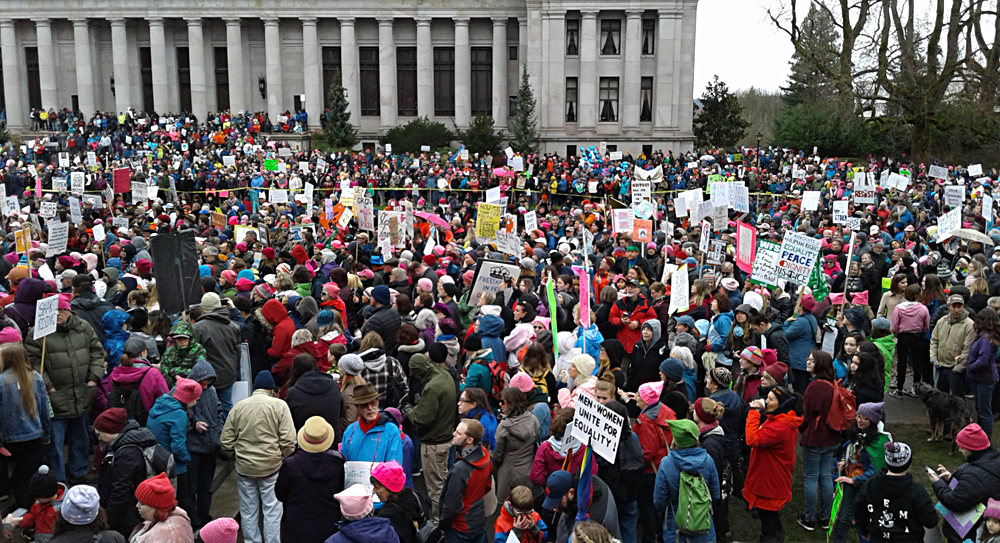 Sign: ''Men - Women - Unite for Equality!''